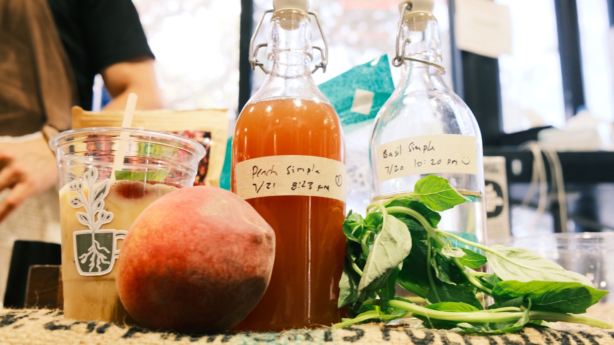 House-made peach and basil simple syrups at Café Con Pan