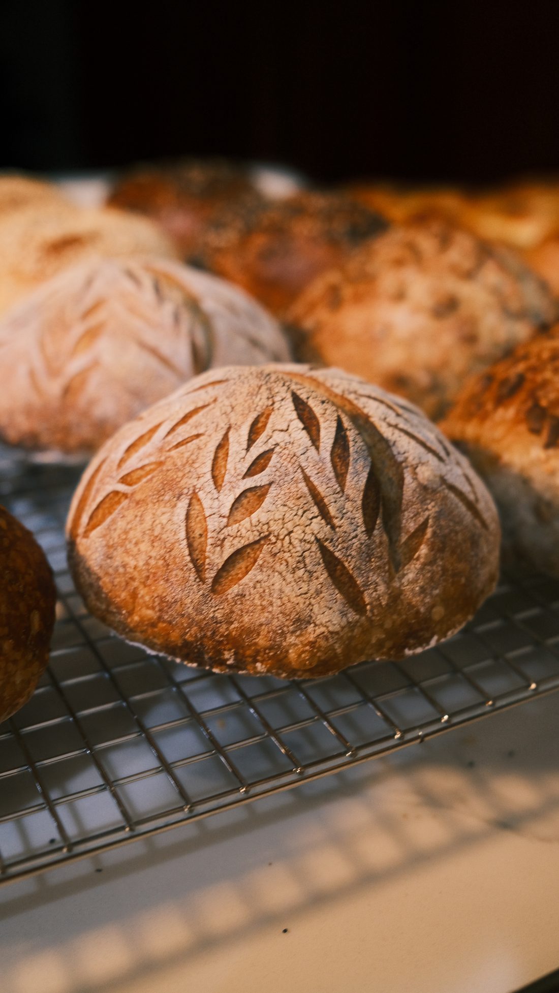 Signature country sourdough with hand-scored leaf pattern